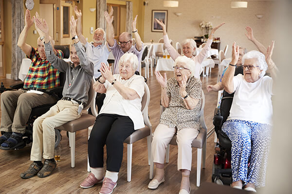 seniors doing chair exercises